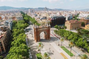 aerial view of barcelona urban skyline and the arc de triomf or arco de triunfo in spanish, a triumphal arch in the city of barcelona. sunny day.