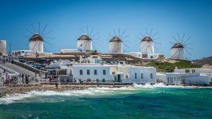 mykonos, cyclades islands, greece. famous windmills during a clear and bright summer day.