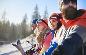 group of snowboarders admiring the view