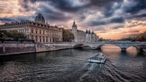 conciergerie and seine river in paris at sunset