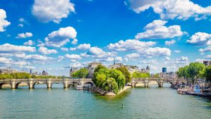 pont neuf, the oldest bridge in paris france and the river seine on a sunny day