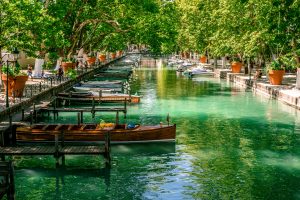wood boat and canal view taken from bridge of loves annecy france